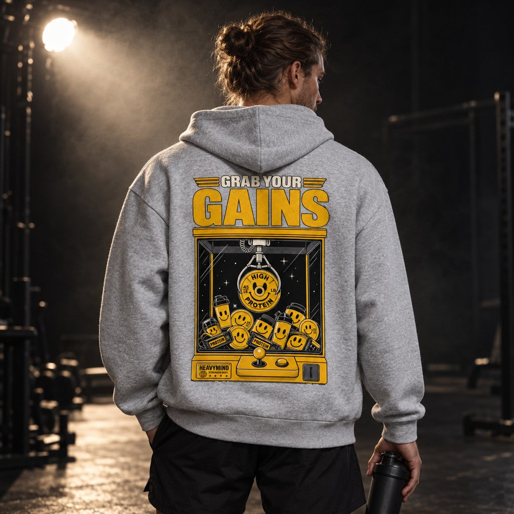 Grab Your Gains – Heavy Oversized Hoodie in Heather Grey, am Model, Rückansicht | Heavy Mind